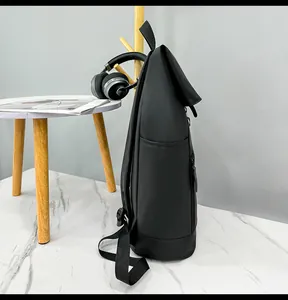 Side view of waterproof black roll-top backpack with adjustable straps and side pocket