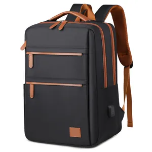 Sleek black business laptop backpack with brown leather accents and a built-in USB charging port