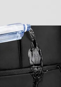 Detail showing waterproof film fabric of black travel backpack with water droplets
