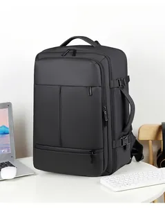 Detail of waterproof travel backpack showing side handle and compression straps on a desk
