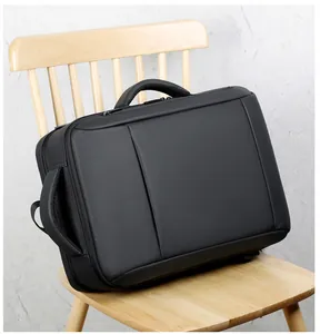 Détail du sac à dos noir pour ordinateur avec doubles poignées et texture de qualité