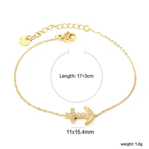 Detail of gold stainless steel chain bracelet with cross and anchor charms, length 17+3cm