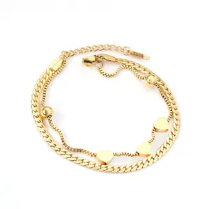 Double-layered 18k gold stainless steel bracelet with heart charms and curb chain