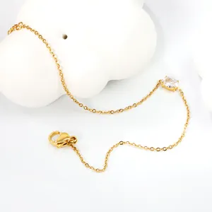 Elegant gold thin chain bracelet with an oval clear zircon and a secure lobster clasp