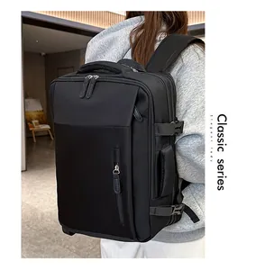 Detail view of the black travel backpack featuring reinforced handles and adjustable buckles