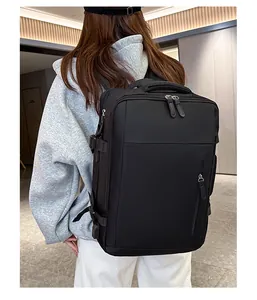 Rear view of a black expandable travel backpack with thick breathable handles and side buckles