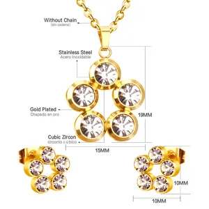 Close-up of gold stainless steel flower jewelry set with sparkling white zirconia stones