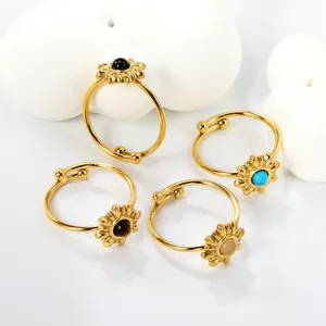 Set of four gold stainless steel sunflower open rings with colorful stones