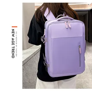 Detail view of purple business travel backpack showing side handle and buckle closure