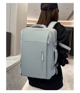Blue travel backpack with water-resistant fabric shown in professional business setting
