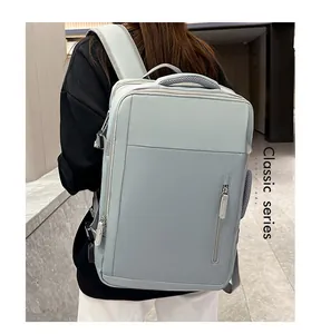 Close-up of light blue travel backpack with cushioned shoulder straps and smooth zippers