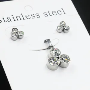 Three-piece stainless steel jewelry set with white round crystals and stud earrings