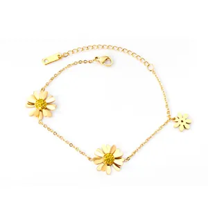 Golden double-layer stainless steel bracelet featuring three daisy charms with yellow crystals