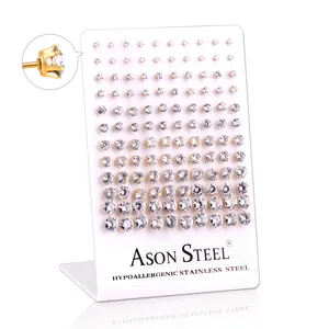 Detailed set of sixty pairs of hypoallergenic stainless steel gold studs with cubic zirconia