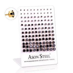 Macro view of black cubic zirconia earrings set with gold-plated stainless steel base
