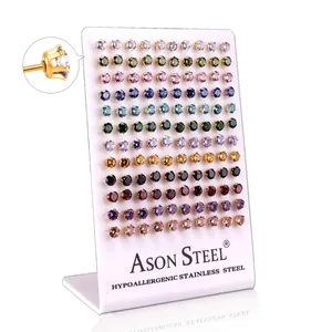 Macro shot of hypoallergenic stainless steel stud earrings with multi-color cubic zirconia