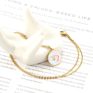 Macro detail of Virgo zodiac pendant with white mother-of-pearl and gold steel chain