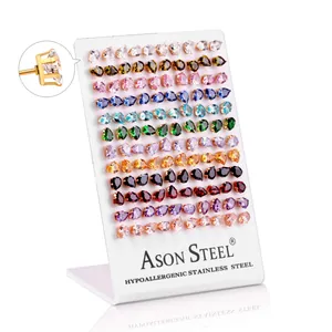 Macro view of hypoallergenic stainless steel stud earrings set with colorful teardrop stones