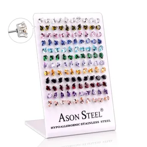Macro detail of teardrop cut colorful zircons with hypoallergenic stainless steel setting