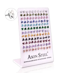 Detail of 12-color hypoallergenic stainless steel triangle stud earrings set with CZ stones