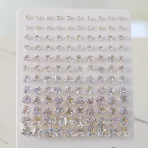 Macro detail of square cut zircon stud earrings in various sizes on a display card
