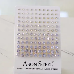 Detailed view of assorted round zircon stud earrings in gold-plated stainless steel