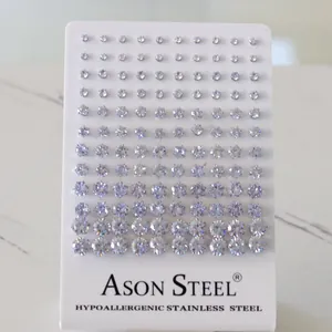 Macro view of hypoallergenic stainless steel stud earrings set with clear round crystals