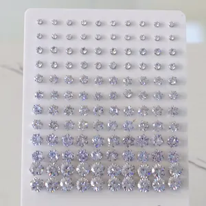 Detailed view of multiple sizes of round cubic zirconia studs on a white display card