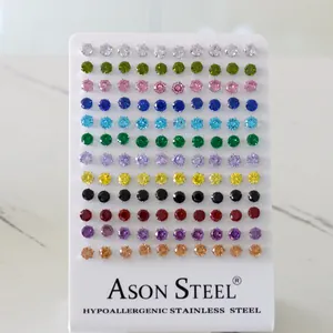 Close-up of 60 pairs of hypoallergenic stainless steel earrings with colorful round zircons