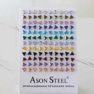 Detailed view of colorful triangle stud earrings set displayed on white card