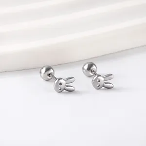 Cute stainless steel rabbit stud earrings with screw back on a white display stand