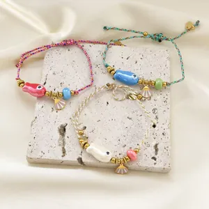 Three-piece bohemian braided rope bracelets with fish ceramic pendants and shells