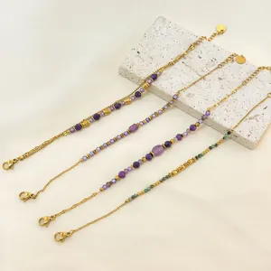 Set of four 18K gold plated stainless steel bracelets with purple chalcedony beads