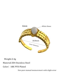 Detail of 18K gold plated stainless steel ring with a white teardrop natural stone