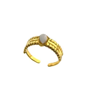 Adjustable 18K gold-plated stainless steel ring with teardrop opal stone and textured band