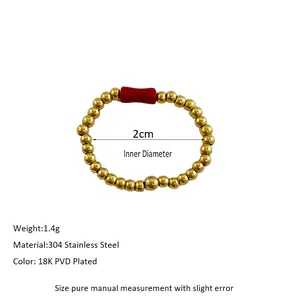 Macro shot of 18K PVD gold plated 304 stainless steel beaded ring with red tube stone