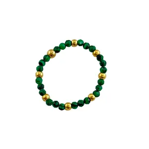 Elastic beaded ring featuring green malachite stones and 18K gold plated steel beads
