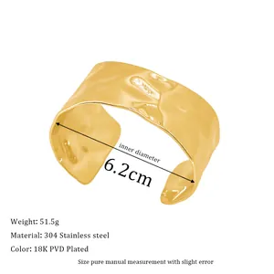 Detail of 18K PVD gold plated stainless steel bangle with a hammered texture finish