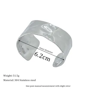 Detail of silver 304 stainless steel bangle with hammered texture and 6.2cm inner diameter