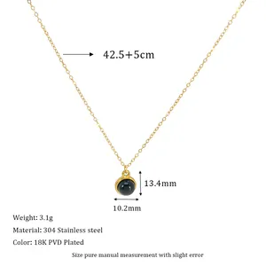 Detail of 18K PVD gold plated stainless steel necklace with round black natural stone