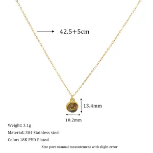 Detail of round Tiger Eye pendant on 18K PVD gold plated stainless steel necklace chain