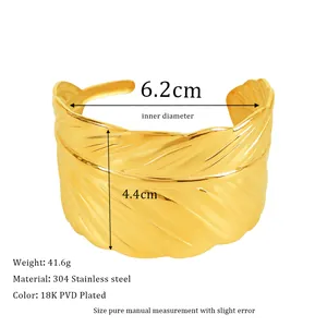 Detail of 18K PVD gold plated 304 stainless steel feather cuff with size measurements