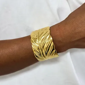 Chic gold feather cuff bracelet made of polished stainless steel for women