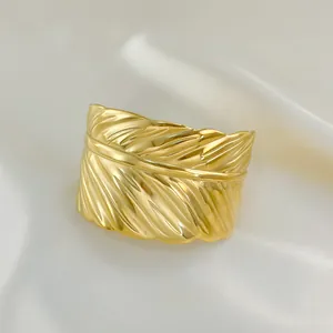 Retro wide feather open bangle in gold stainless steel with detailed textures