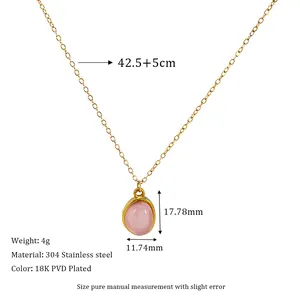 Detail view of pink oval stone pendant on 18K gold plated stainless steel necklace