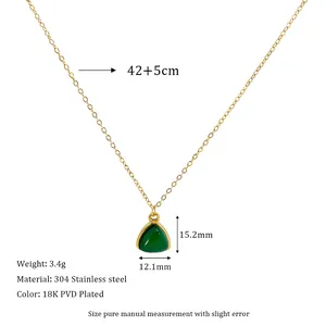 Macro detail of gold 304 stainless steel chain with 15.2mm green triangle stone pendant
