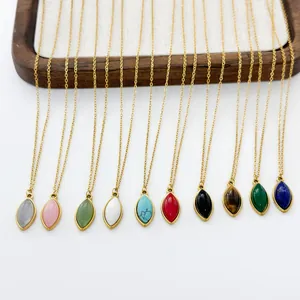 Set of 10 gold necklaces with assorted marquise-shaped natural stone pendants on a tray