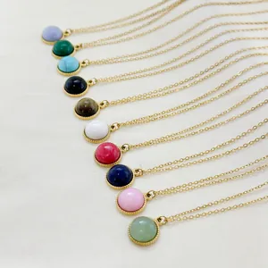 Golden necklace collection featuring ten colorful natural stone pendants on a textured background