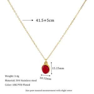 Detail view of 18K gold plated stainless steel necklace with red stone pendant and specs