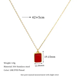 Macro detail of 18K gold-plated necklace with a red rectangular pendant and measurements
